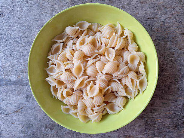 Shell Shells Conchiglie Macaroni Pasta in a Bowl. Food Menu. Top View.
