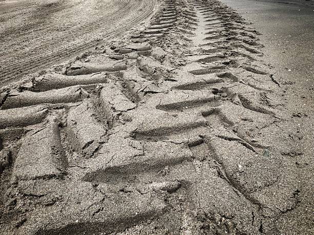 istock Wheel tracks on the soil. 2227315753