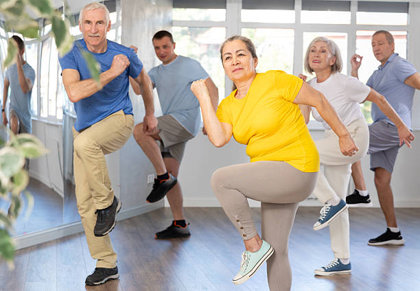 istock Elderly woman dances modern dances in group 2227317021