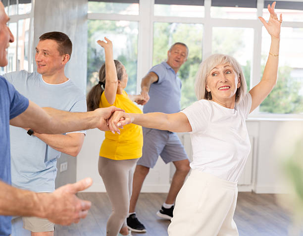istock Mature men and wome learn energetic twist dance in choreography studio 2227317061