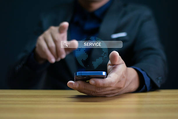 istock Customer Service and Support Businessman providing digital support with global communication icons Contact Us Page Online Help Desk 2227317320