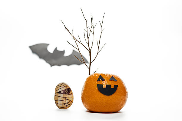 istock Creative Halloween characters made from an orange and a stone, isolated on white. 2227317676