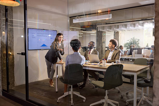 istock Happy female manager leading a modern presentation in the office. 2227321088