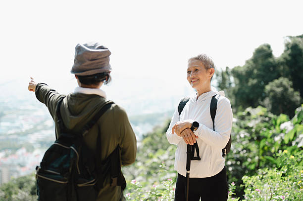 istock Happy Senior Friends Rest and Talk After a Mountain Walk. 2227321652