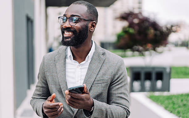 istock Businessman texting outdoors. 2227322759
