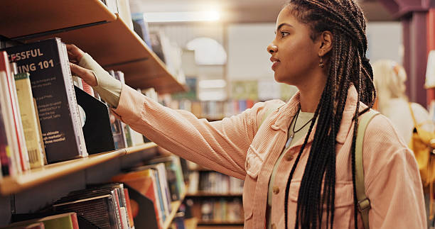 istock Student, shelf and learning with books in library for choice, studying and preparation of exam. Woman, return or textbook decision for information, university knowledge and wisdom of education thesis 2227322927