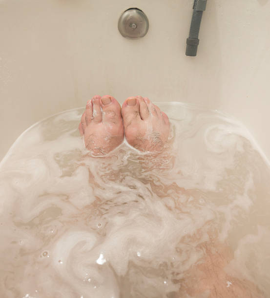 istock Man in a bath. Male client in an aroma bath at a spa 2227325061