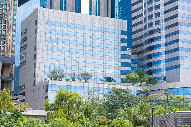 istock Green city park with modern office building 2227328428