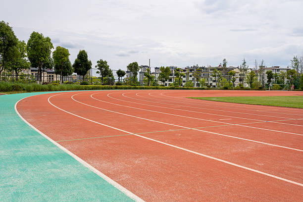 Red rubber synthetic running track on the stadium for healthy exercise