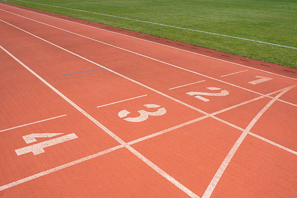 istock Red rubber synthetic track on the stadium 2227330679