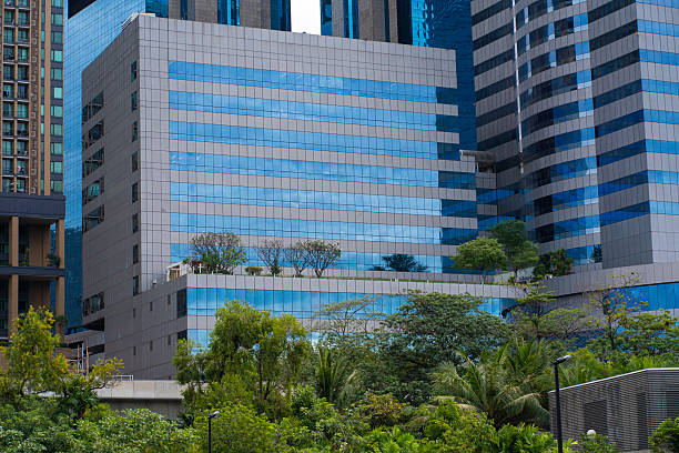 istock Green city park with modern office building 2227330815