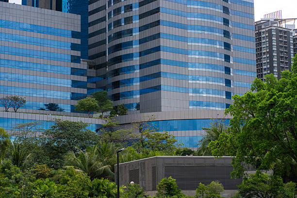 istock Green city park with modern office building 2227330821