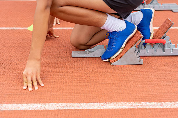 istock Athletes preparing to start at the stadium 2227330866