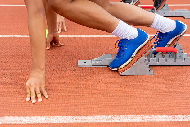 istock Athletes preparing to start at the stadium 2227330871