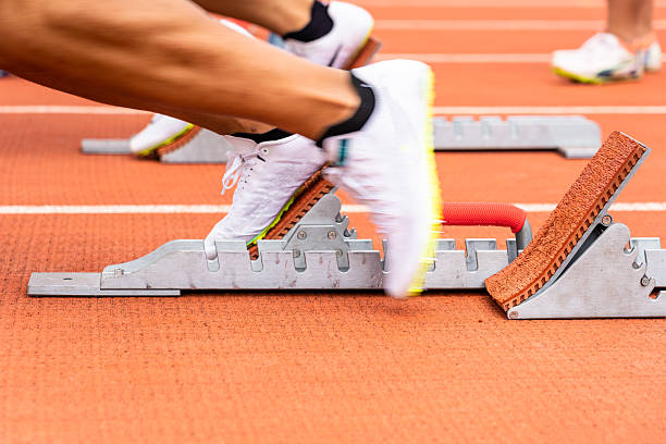 istock Athletes preparing to start at the stadium 2227330899