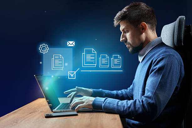 istock Business professional working on a laptop with digital elements in a modern office environment 2227331962