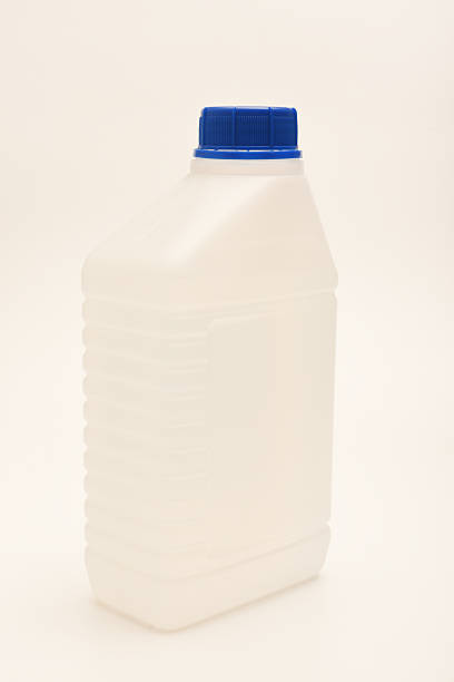 istock A white plastic container with a blue lid. A small plastic canister. A container with liquid. 2227333746