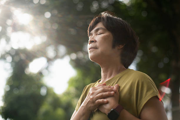 istock Mature woman relaxing in park. 2227333831