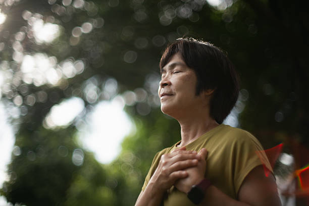 istock Mature woman relaxing in park. 2227333850