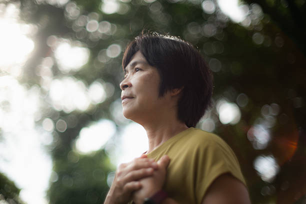 istock Mature woman relaxing in park. 2227333853