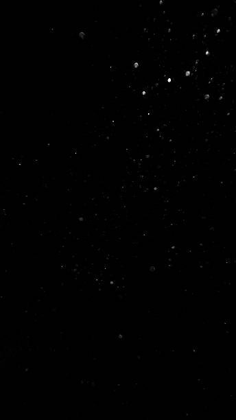 istock Small Particles Flying in the Air Isolated on Black 2227334768