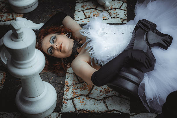 Mysterious woman dressed in black gothic dress.