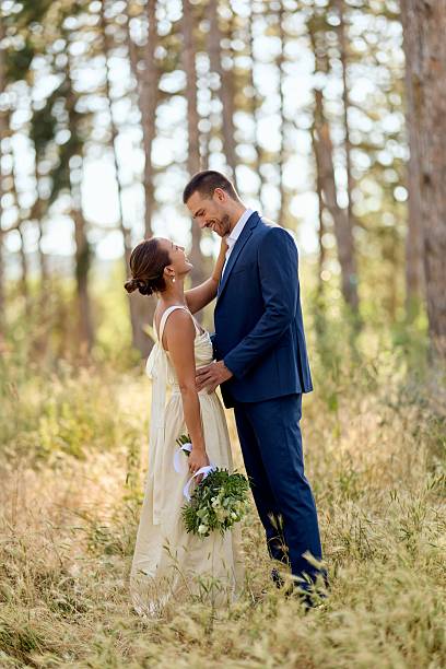 istock Romantic Couple Enjoying an Outdoor Wedding Ceremony in a Forest Setting 2227337006