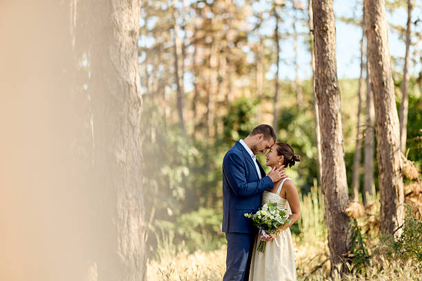 istock Romantic Couple Embracing in a Forest During Their Wedding Celebration 2227337010