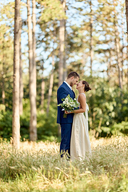 istock Romantic Wedding Couple Embracing Amongst Scenic Forest Landscape 2227337011