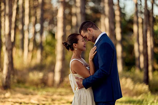 istock Romantic Couple Embracing Outdoors in Beautiful Natural Forest Setting 2227337037