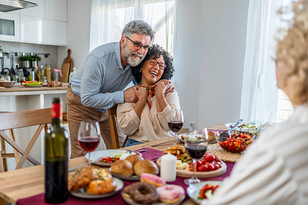 istock Mature couple sharing joyful moment during home dinner party 2227337326