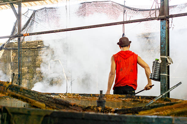 Blue collar Woman portrait inside an ore processing plant