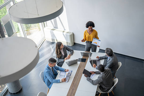 istock Diverse business team analyzing charts during meeting in modern office 2227339172