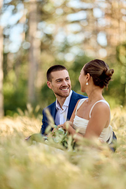 istock Smiling Couple Sharing a Special Moment in a Sunlit Outdoor Setting 2227339869