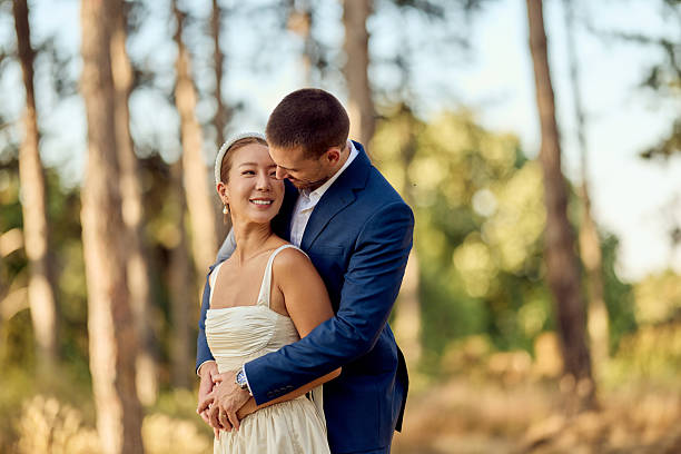 istock Romantic Couple Embracing in a Serene Outdoor Setting with Natural Background 2227339878