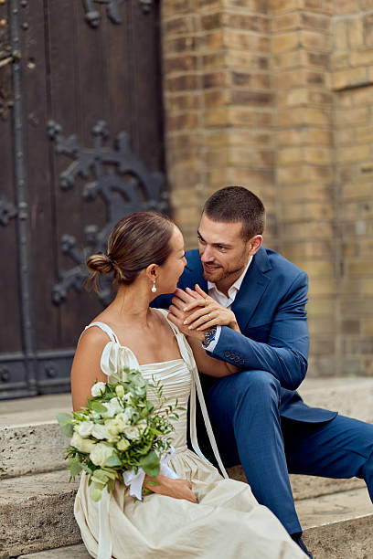 istock Romantic Couple Sharing a Moment Outside a Brick Building on Their Wedding Day 2227339895