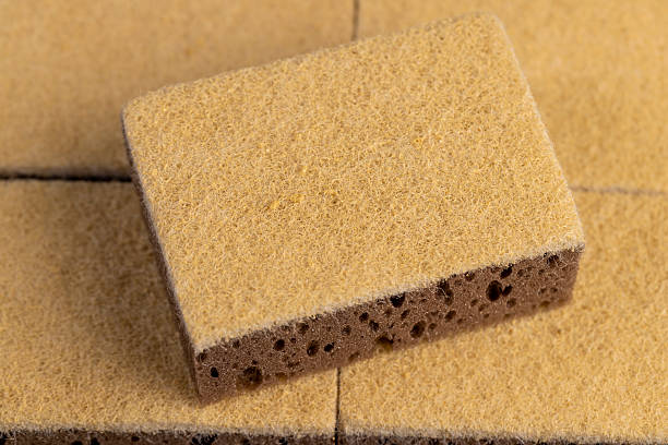 istock fabric for washing objects, glued and tightly intertwined synthetic sand-colored threads on a sponge that is used for cleaning and washing 2227340092