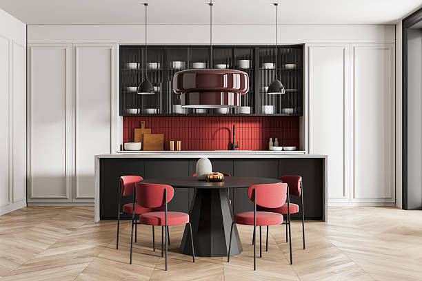 istock Modern kitchen interior with red backsplash, round dining table, and stylish chairs in a contemporary minimalist design setting. 3D Rendering. 3D Rendering 2227340913