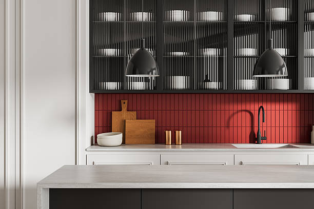istock Modern kitchen interior with red tile backsplash, minimalist cabinetry, and elegant decor elements in a contemporary design concept. 3D Rendering 2227342259