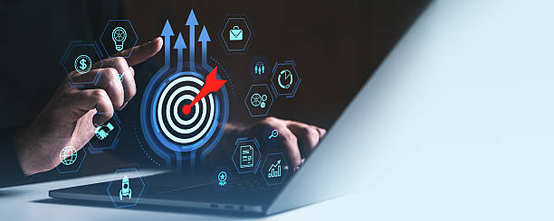 istock Business strategy concept with digital target and icons representing growth, innovation, and success goals on dark background with laptop interaction. 2227342398