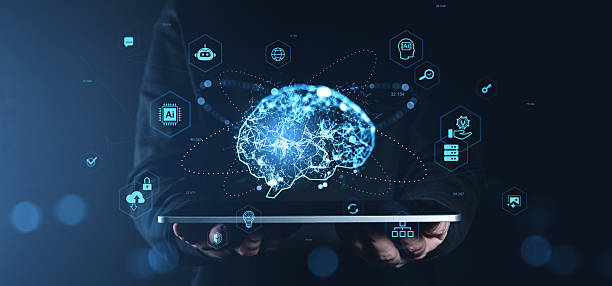 istock Futuristic digital brain with neural connections and AI icons floating above a tablet held by hands on a dark blue background, illustrating technology concept. 2227342836