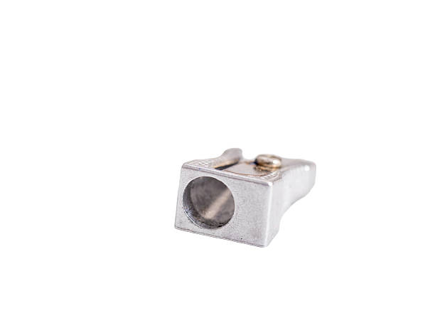 Wooden red pencil with metal sharpener over white background