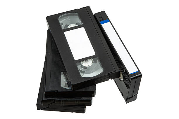 istock Stack of vintage VHS cassettes with blank white labels, arranged on white background, evoking analog nostalgia 2227344189