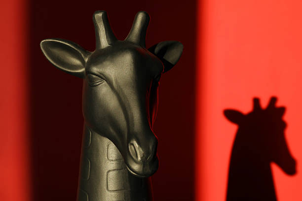 A patterned marble vase shot against a black background