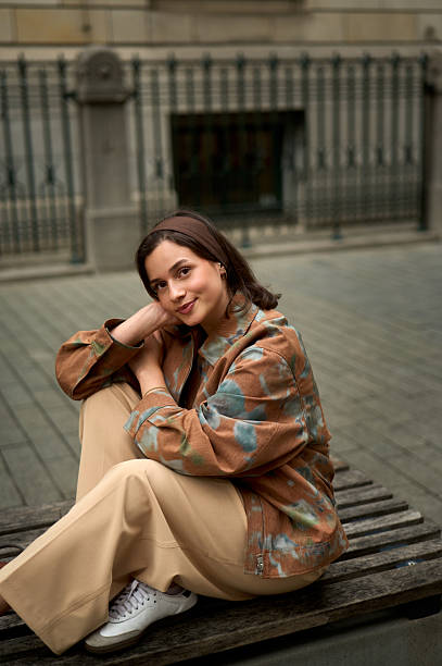 Fashionable young woman enjoying a moment of peace in a city environment