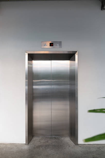 istock Elevator door and concrete floor in high rise building. 2227349594