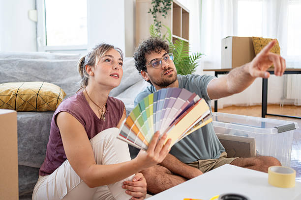 istock Young adults moving in and choosing paint shades 2227351238