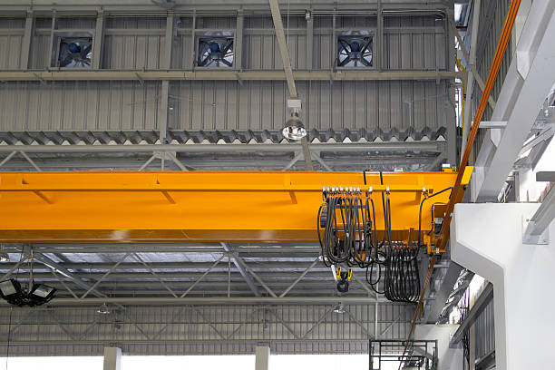 istock Overhead crane or lifting equipment inside factory or warehouse. 2227352175
