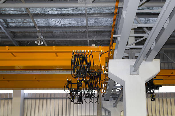 istock Overhead crane or lifting equipment inside factory or warehouse. 2227352951