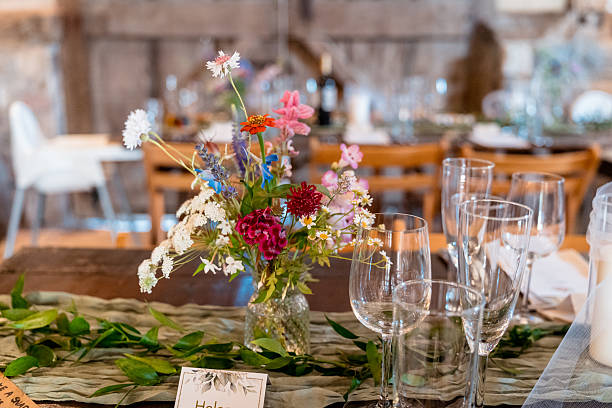 istock Wedding reception meal place arrangement with flowers 2227353126